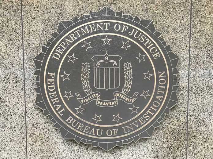 U.s.,Department,Of,Justice/fbi,Emblem,On,The,Outside,Entrance,Wall