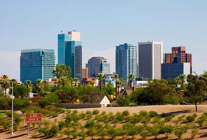 City skyline with tall buildings and greenery.