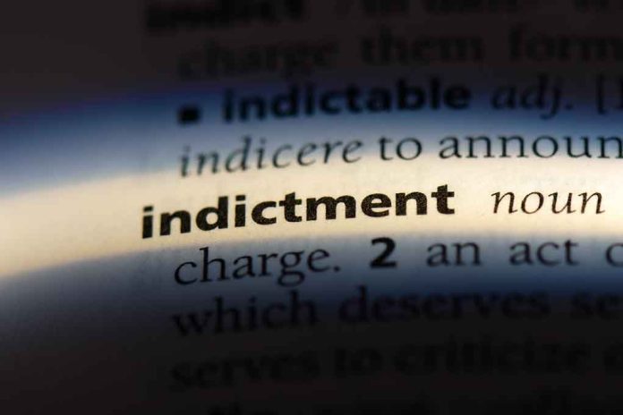 Close-up of the word indictment in a dictionary