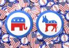 Republican elephant and Democratic donkey buttons, surrounded by flags.