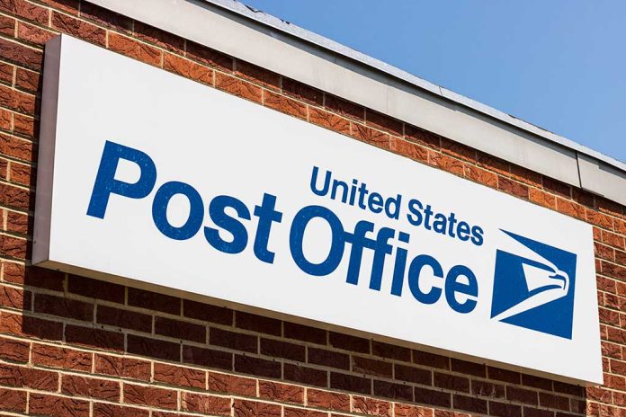 United States Post Office sign on brick building.