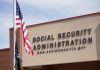 Social Security Administration building with American flag outside.