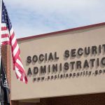 Social Security Administration building with American flag outside.