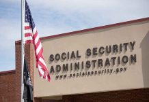 Social Security Administration building with American flag outside.