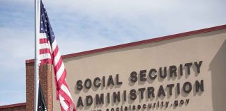 Social Security Administration building with American flag outside.