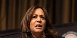 Woman speaking at a podium.