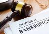 Judges gavel beside Chapter 11 bankruptcy documents