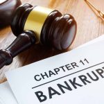 Judges gavel beside Chapter 11 bankruptcy documents