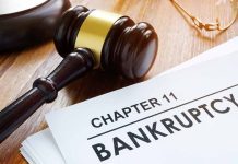 Judges gavel beside Chapter 11 bankruptcy documents