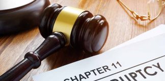 Judges gavel beside Chapter 11 bankruptcy documents