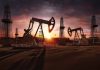 Oil pumps operating at sunset in a desert