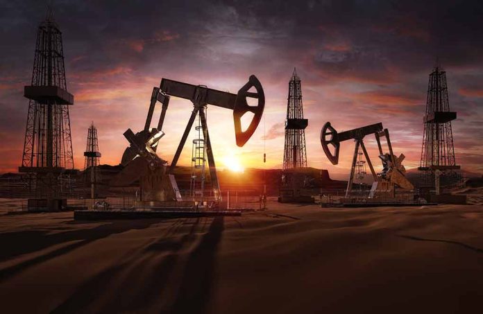 Oil pumps operating at sunset in a desert