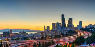 City skyline with highways at sunset.