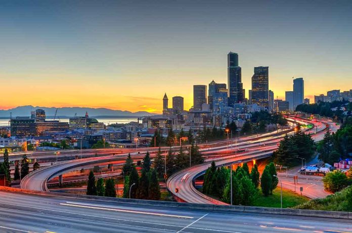 City skyline with highways at sunset.