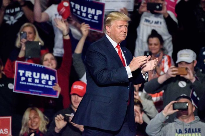 Person clapping at a political rally event.