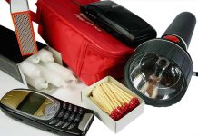 Emergency kit with flashlight matches phone and candles