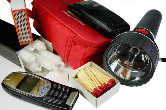 Emergency kit with flashlight matches phone and candles