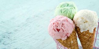 Three ice cream cones in a pink basket.