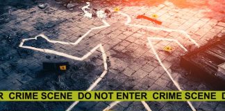 Chalk outline at a crime scene with evidence markers.