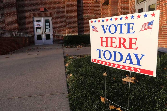 1909092859 featured image "Vote Here Today" sign outside a building entrance.