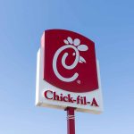 Chick-fil-A sign with blue sky background.
