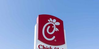Chick-fil-A sign with blue sky background.