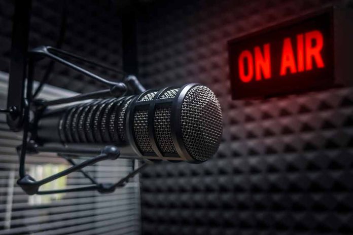 Microphone in studio with "On Air" sign.