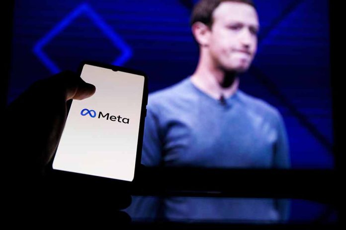 Person holding phone displaying Meta logo screen