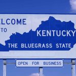 Welcome to Kentucky state sign with blue sky