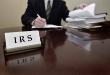 IRS sign on desk with person working