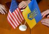 Flags of USA and Ukraine on table