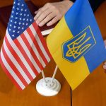 Flags of USA and Ukraine on table