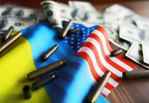 Flags, bullets, and dollar bills on a table.