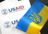 USAID documents with Ukrainian flag on table