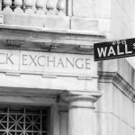 Stock Exchange building and Wall Street sign.