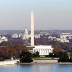 Washington D.C. monuments with autumn foliage.