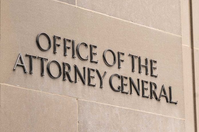 "Office of the Attorney General" sign on concrete wall.