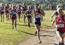 Runners competing in an outdoor cross country race