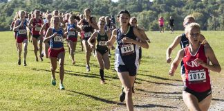 Runners competing in an outdoor cross country race