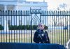 Secret Service agent stands guard outside the White House.