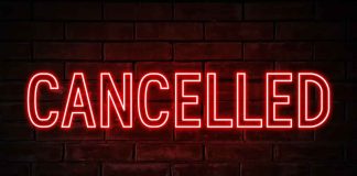 Neon sign that says cancelled