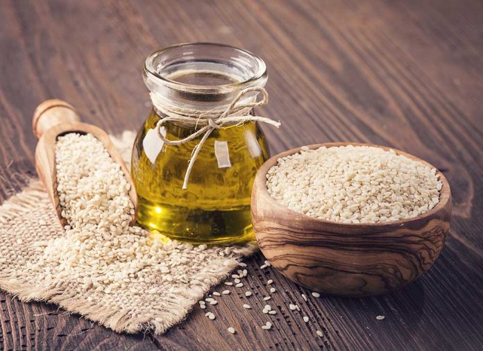 633045449 featured image Jar of oil, sesame seeds in bowl.
