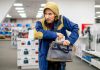 Person in store hiding something in a bag