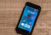 Incoming call labeled SCAM on smartphone screen