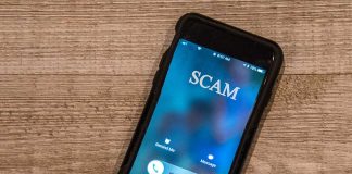 Incoming call labeled SCAM on smartphone screen