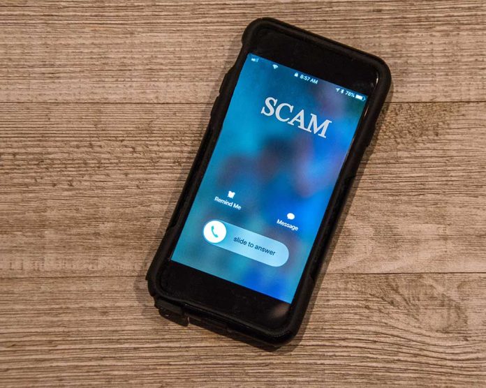 1252782130 featured image Incoming call labeled SCAM on smartphone screen