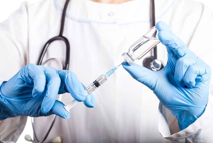 1310971853 featured image Doctor filling syringe with vaccine from vial