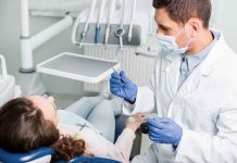 Dentist examining a patient in a dental chair