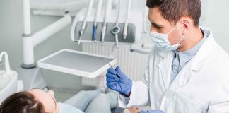Dentist examining a patient in a dental chair