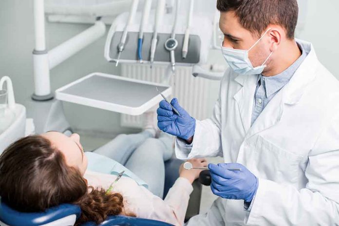 1317916853 featured image Dentist examining a patient in a dental chair